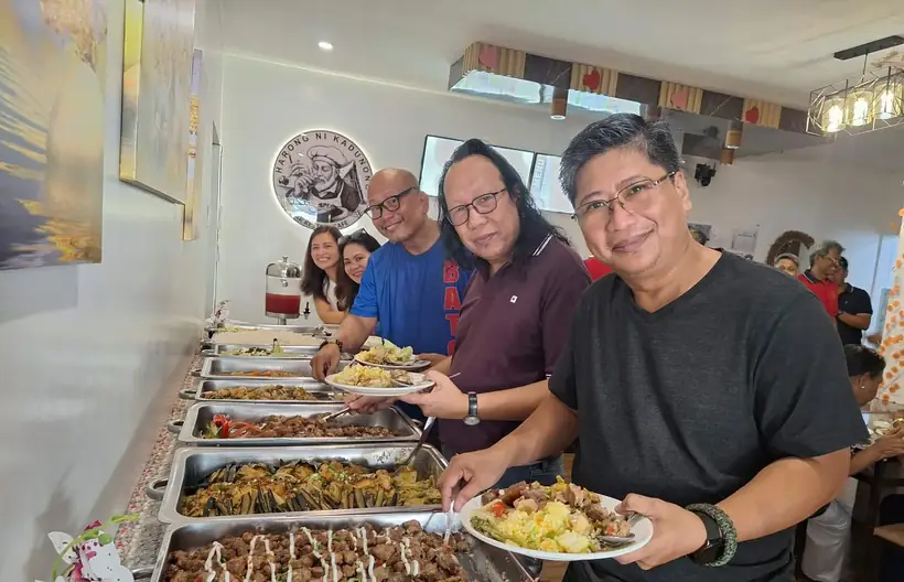 Guests enjoying a shared buffet at Harong ni Kadunong